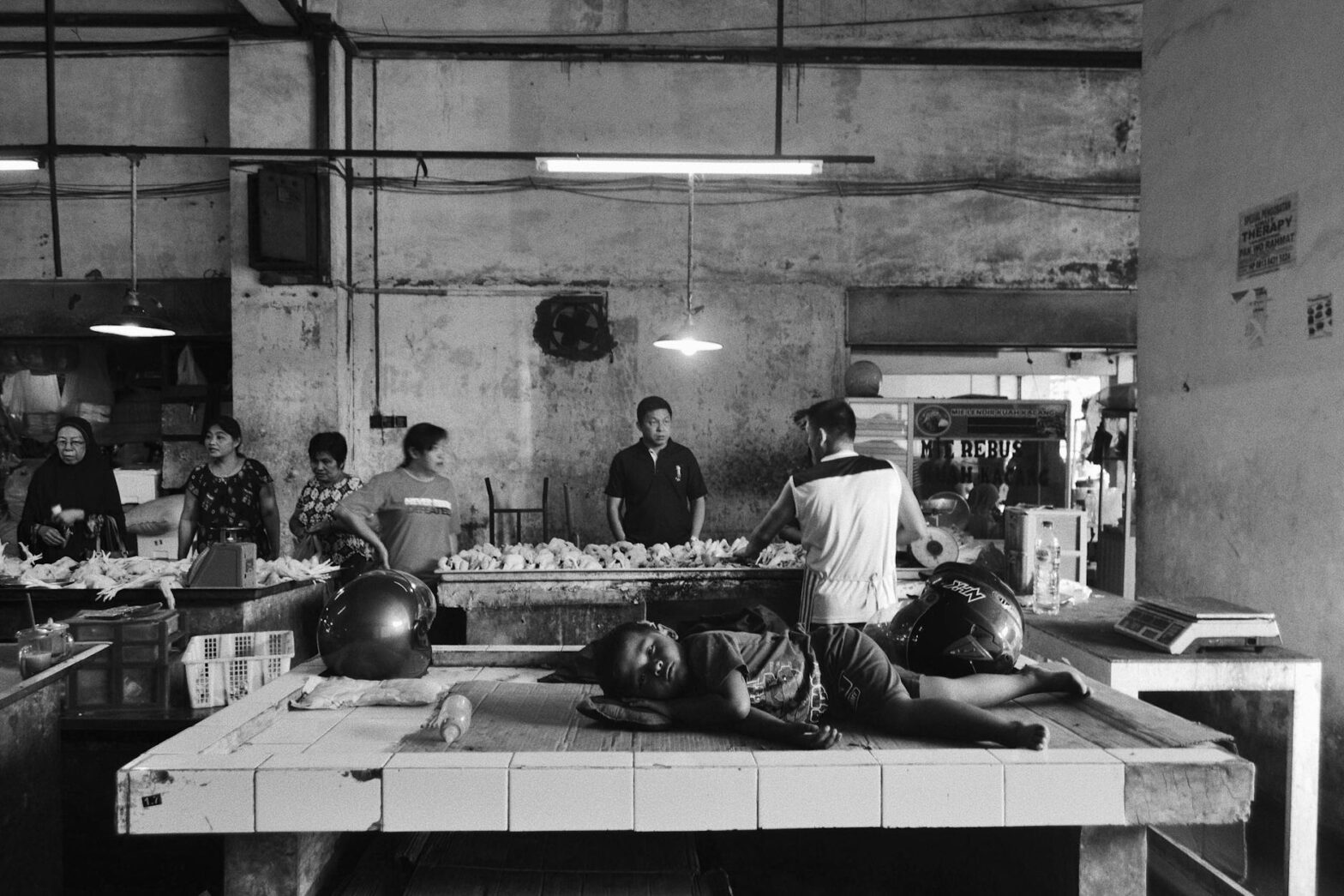 child sleeping on tiled table